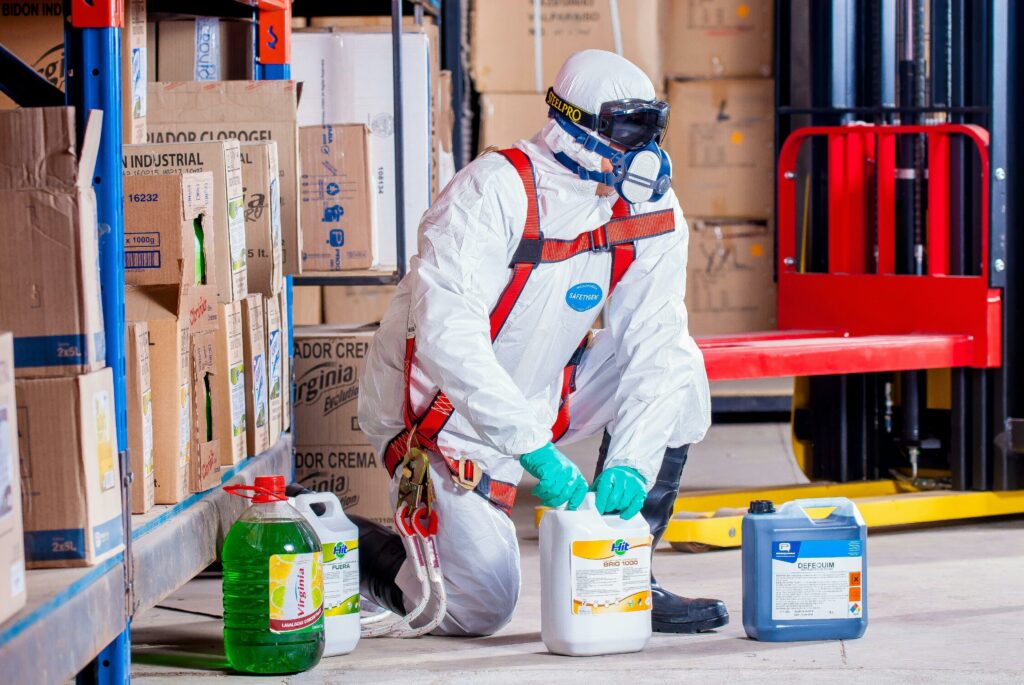worker in a hazmat suit in a hazardous zone using complexus trackers and geofences
