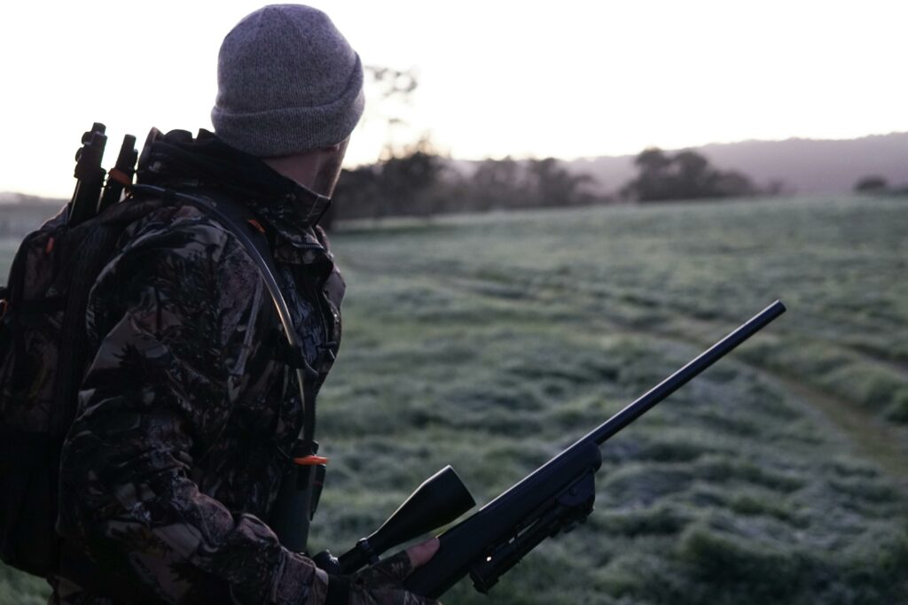 hunter with hunting rifle using complexus tracker
