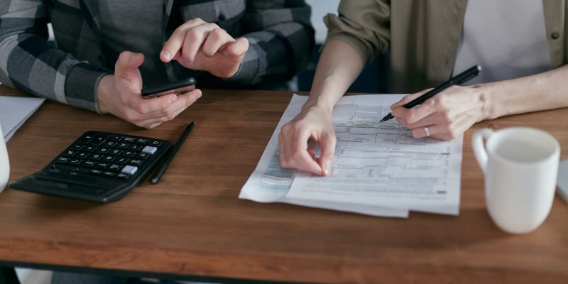 people conducting their tax calculations